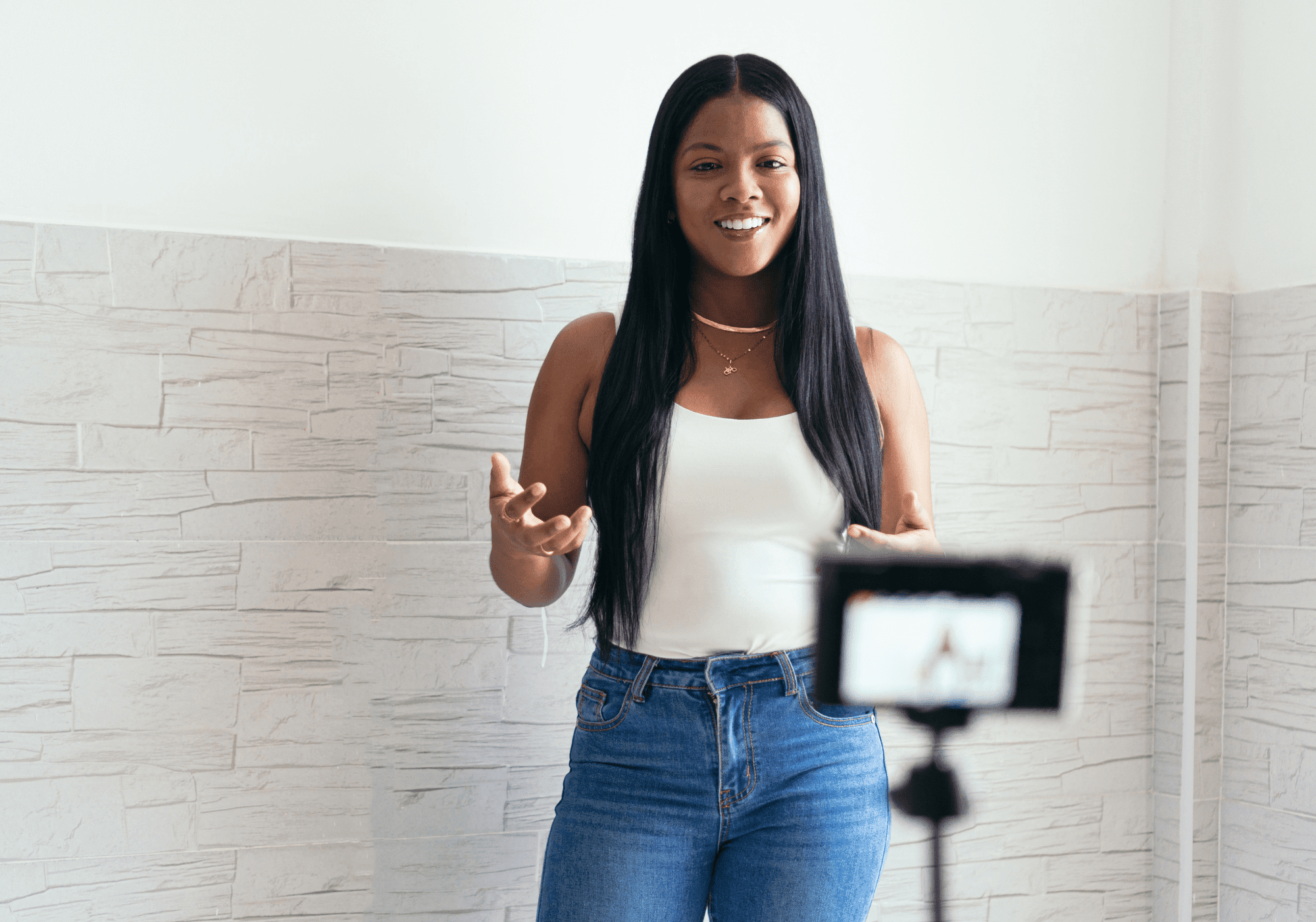Young woman filming herself talking