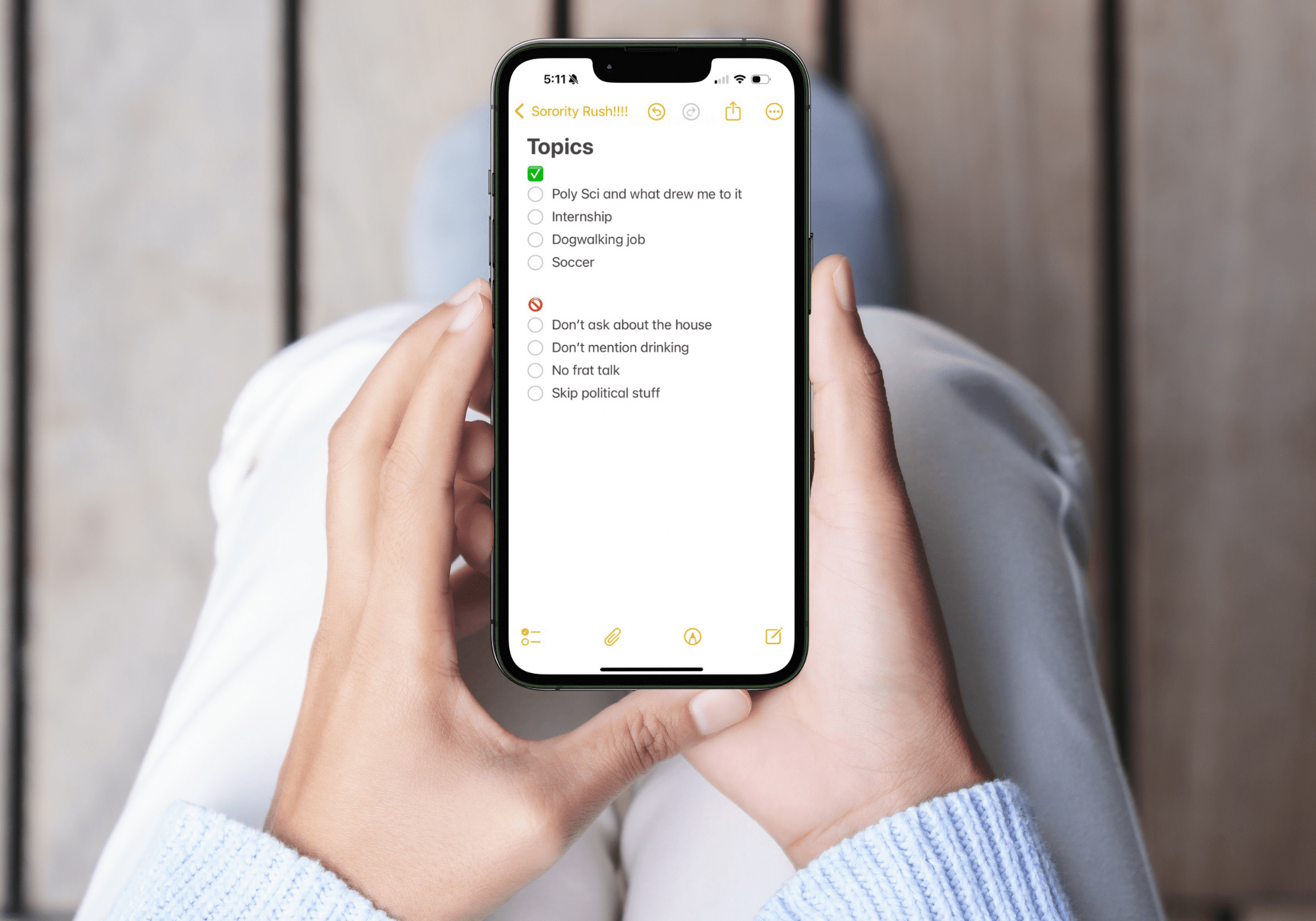 Woman holding iphone with notes app open to a list of topics to say and not say during sorority recruitment